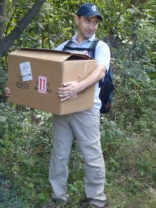 Javier_carries_box_into_forest Frogs being carried into the forest for release