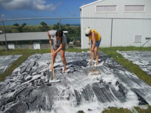 Scrubbing the pond liner 